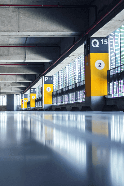 empty-garage-with-parking-lots-with-concrete-ceiling-flooring-pillars-marked-with-numbers-1 empty-garage-with-parking-lots-with-concrete-ceiling-flooring-pillars-marked-with-numbers-1